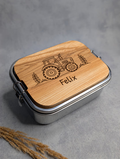 Geschlossene Edelstahl-Lunchbox mit Traktor-Motiv und Beispielname Felix in Patrick Hand